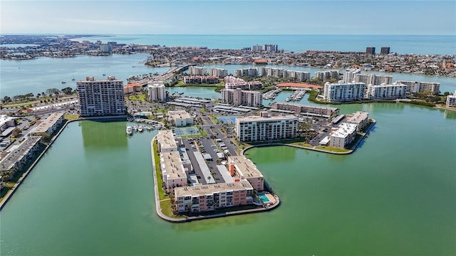 drone / aerial view with a city view and a water view