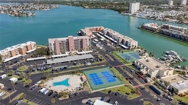 birds eye view of property with a view of city and a water view