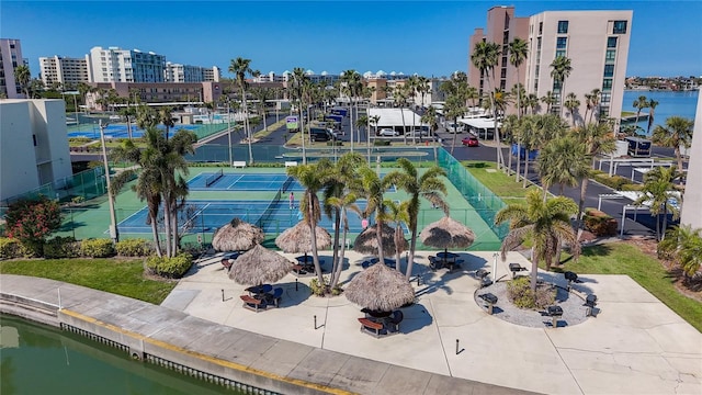 drone / aerial view featuring a water view and a view of city