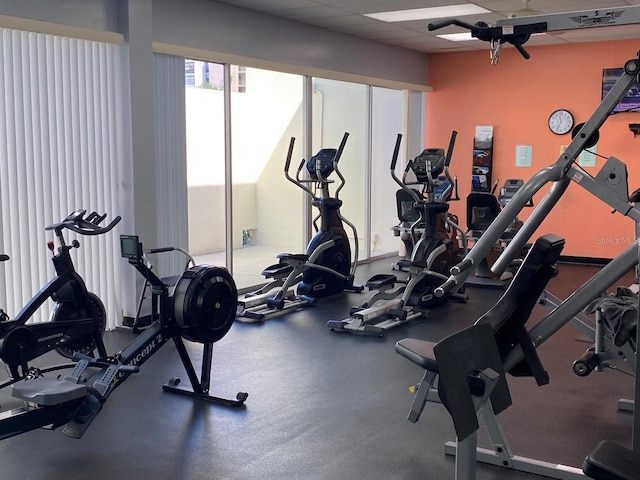 workout area featuring a drop ceiling