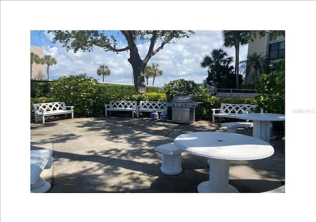 view of patio featuring a grill