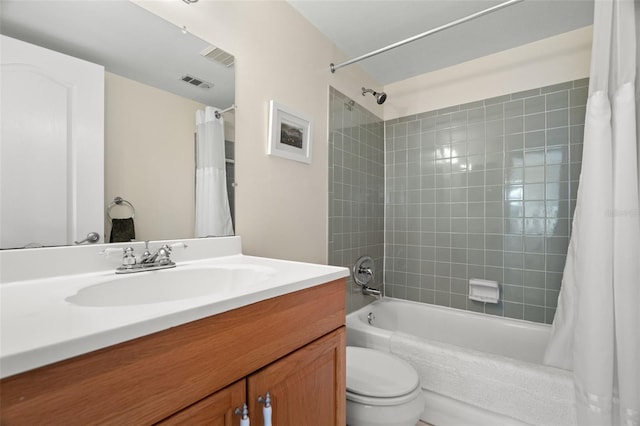 full bathroom featuring visible vents, shower / bath combo with shower curtain, toilet, and vanity