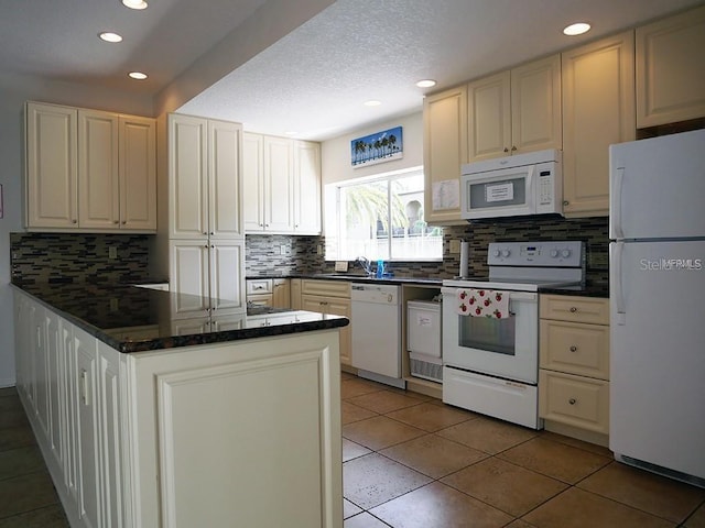 kitchen with backsplash, light tile patterned floors, recessed lighting, a peninsula, and white appliances