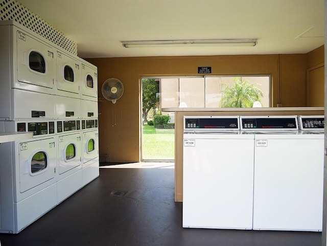 shared laundry area with stacked washer and dryer and washing machine and dryer