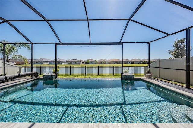 view of pool with a fenced in pool, a water view, a residential view, glass enclosure, and a fenced backyard