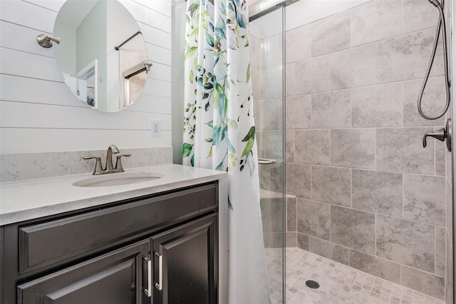 bathroom featuring a stall shower and vanity