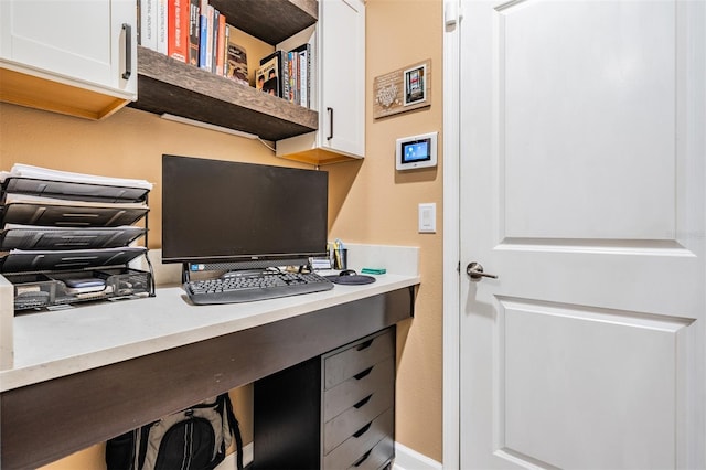 office area featuring built in desk