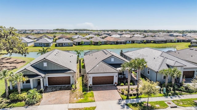 bird's eye view with a residential view and a water view