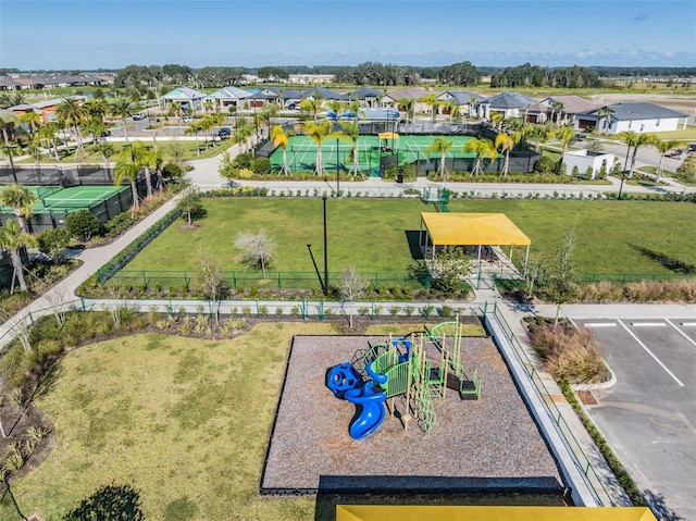 birds eye view of property with a residential view