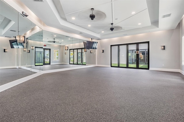 unfurnished room with a ceiling fan, baseboards, visible vents, a tray ceiling, and recessed lighting