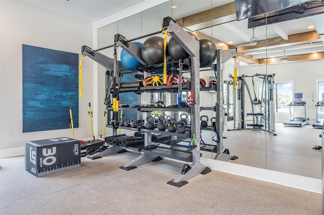 workout area featuring baseboards