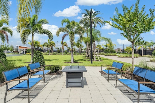 view of patio with a fire pit