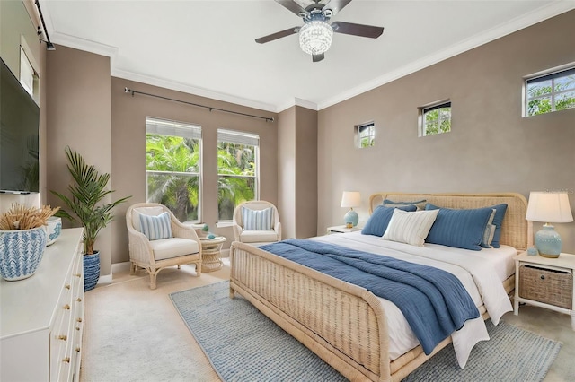 bedroom featuring crown molding, carpet flooring, baseboards, and ceiling fan