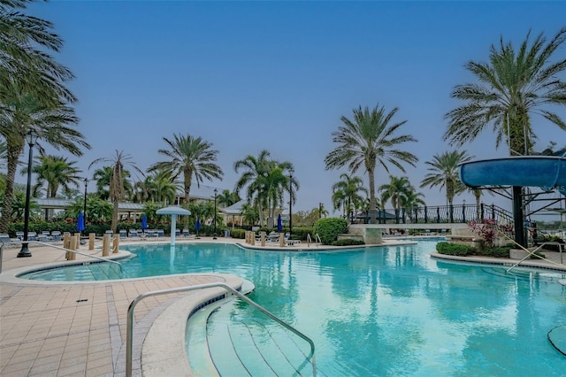 community pool with a patio area