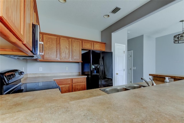 kitchen featuring visible vents, electric range, a sink, light countertops, and black refrigerator with ice dispenser