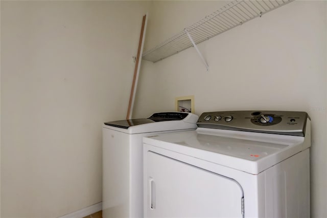 laundry area featuring washer and clothes dryer and laundry area