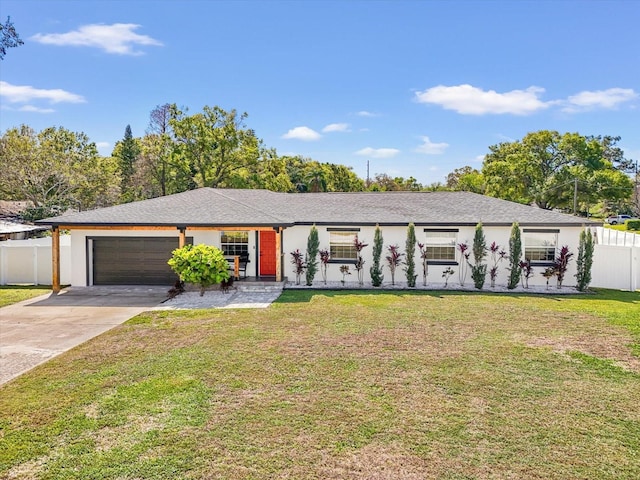 single story home featuring fence, driveway, stucco siding, a front lawn, and a garage