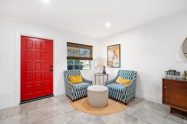 living area with recessed lighting and baseboards