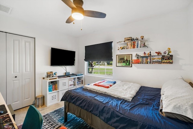 bedroom featuring visible vents, a closet, and ceiling fan