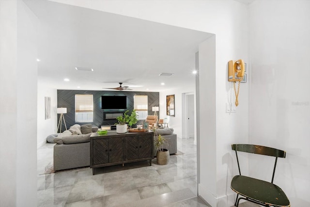 living area featuring recessed lighting and ceiling fan