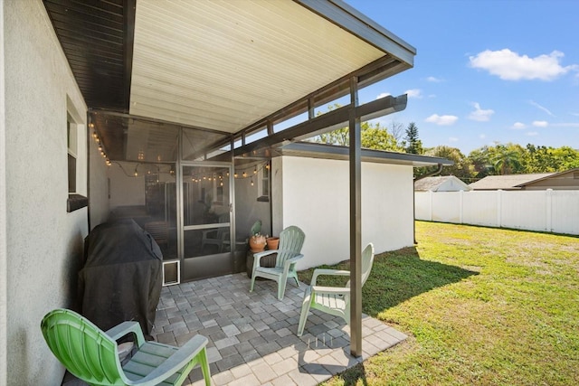 view of patio / terrace featuring fence