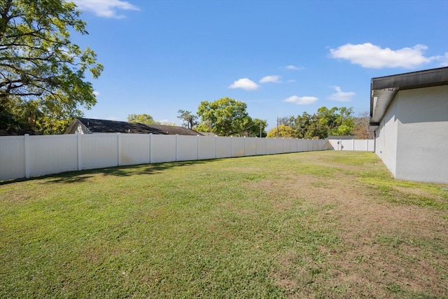 view of yard featuring a fenced backyard