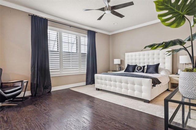 bedroom with a ceiling fan, crown molding, baseboards, and wood finished floors