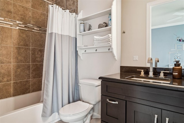 full bath with toilet, ornamental molding, shower / tub combo, vanity, and a ceiling fan