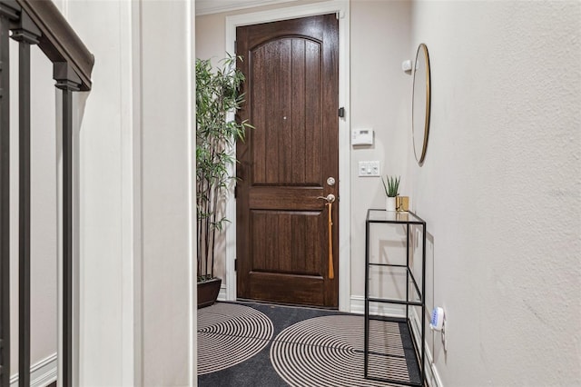 foyer entrance with baseboards