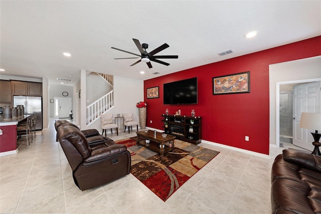 living room featuring stairway, recessed lighting, visible vents, and ceiling fan