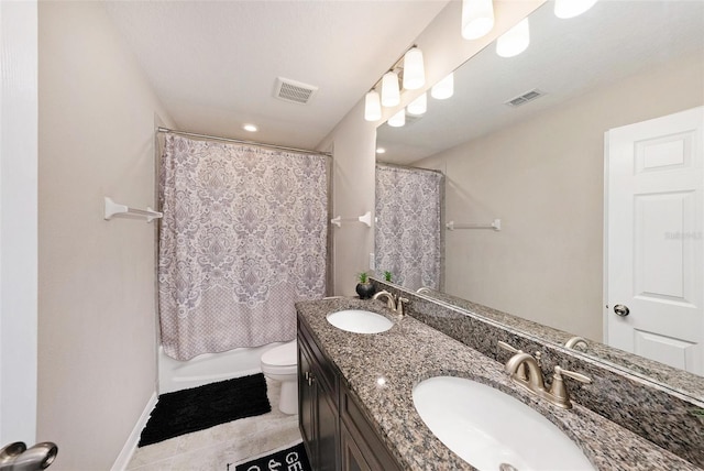 bathroom featuring visible vents, toilet, and a sink