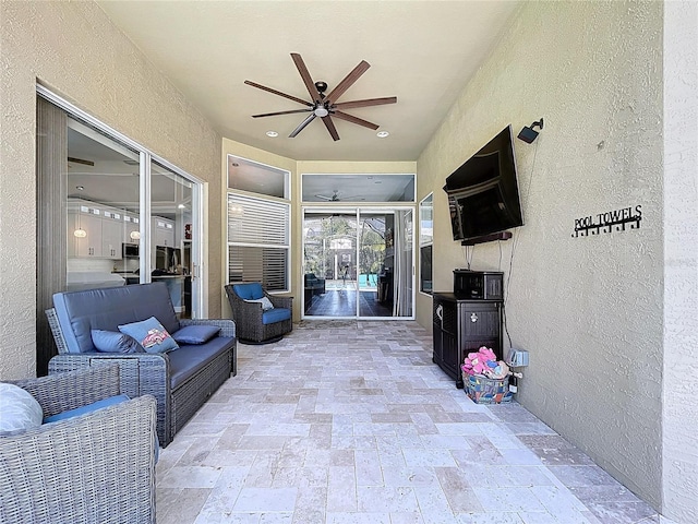 view of patio / terrace featuring an outdoor living space and a ceiling fan