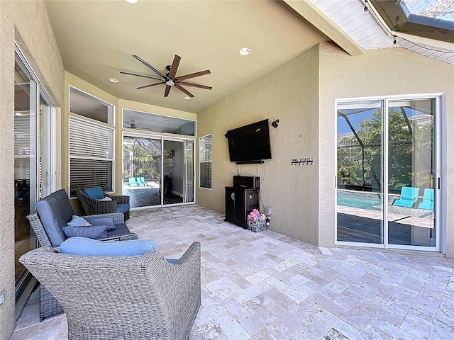 view of patio / terrace with glass enclosure and a ceiling fan