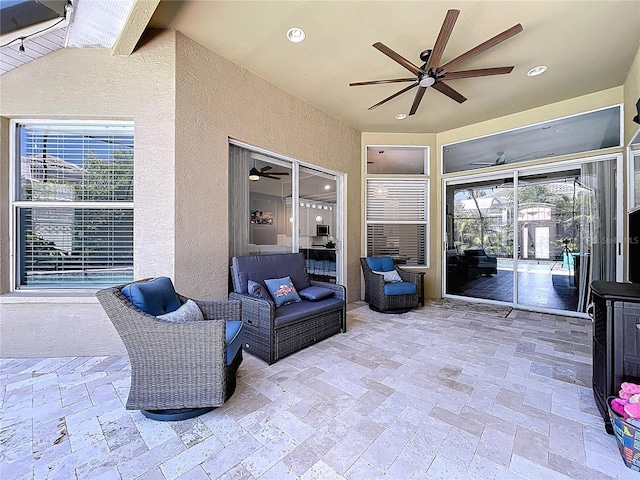 view of patio / terrace with an outdoor living space and a ceiling fan