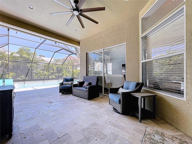 view of patio with glass enclosure, an outdoor living space, an outdoor pool, and ceiling fan