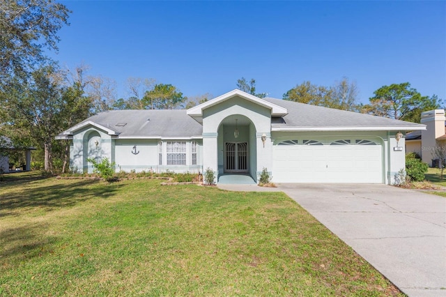 single story home with stucco siding, an attached garage, concrete driveway, and a front yard