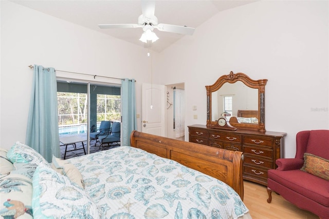 bedroom featuring access to exterior, multiple windows, light wood finished floors, and a ceiling fan