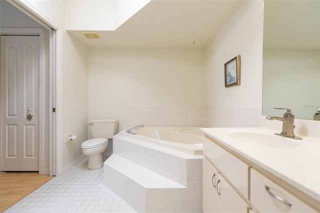 bathroom with vanity, visible vents, a garden tub, toilet, and tile patterned floors