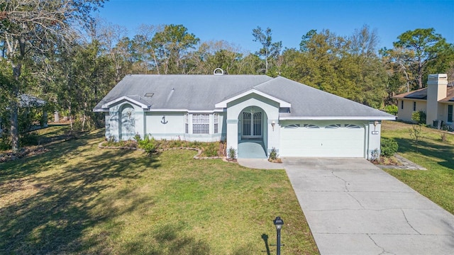 single story home with stucco siding, driveway, an attached garage, and a front lawn