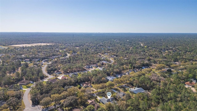 aerial view featuring a wooded view