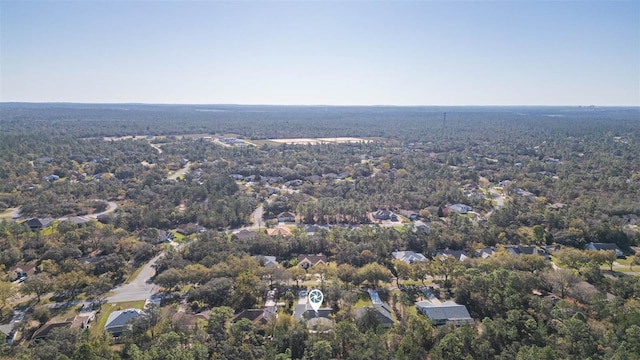 aerial view featuring a wooded view