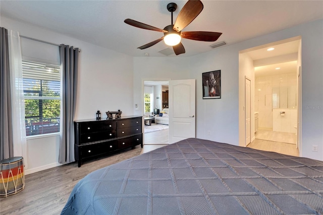 bedroom featuring a ceiling fan, wood finished floors, visible vents, ensuite bath, and recessed lighting