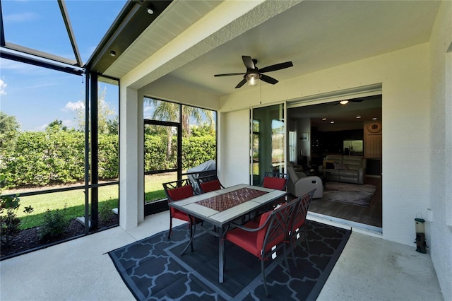 sunroom / solarium with ceiling fan