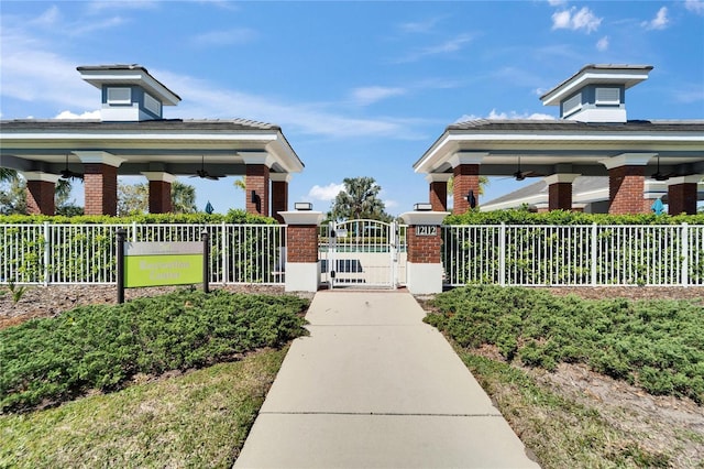 view of home's community with a gazebo, fence, and a gate