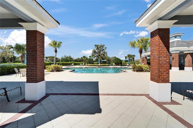 community pool with a patio