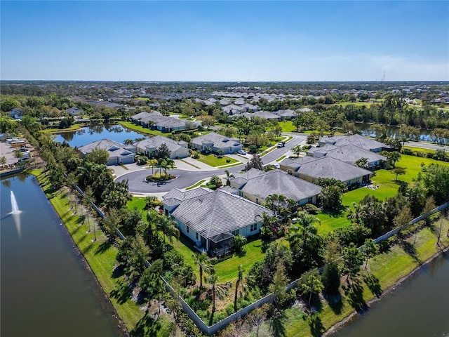 birds eye view of property featuring a residential view and a water view