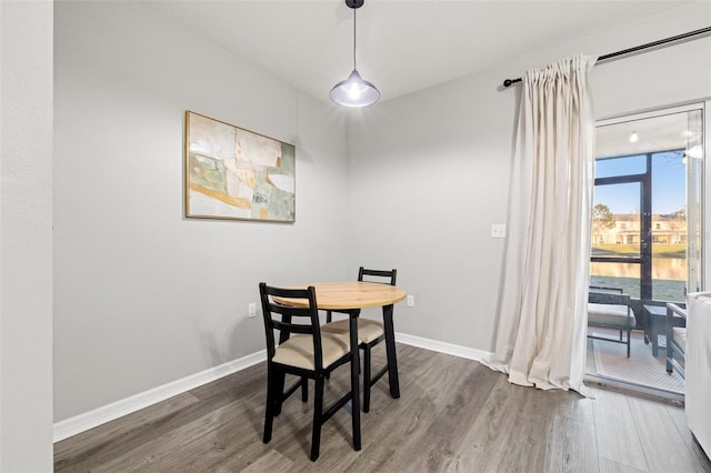 dining room with wood finished floors and baseboards