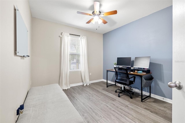 office featuring wood finished floors, baseboards, and ceiling fan