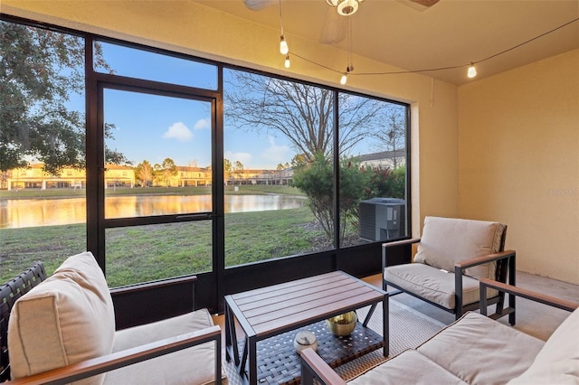 sunroom / solarium with a water view