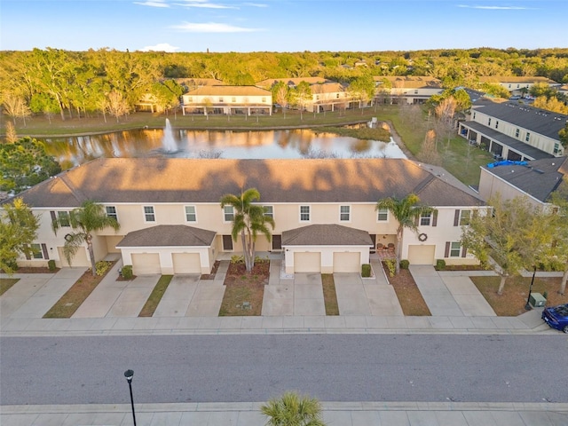 aerial view featuring a residential view and a water view